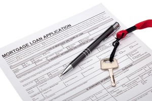 House key with mortgage loan application